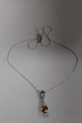 A STERLING SILVER NECKLACE WITH YELLOW STONE PENDANT - APPROX WEIGHT 7.2G