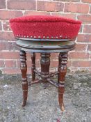 A VICTORIAN MAHOGANY CIRCULAR REVOLVING PIANO STOOL