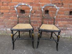 A PAIR OF ANTIQUE EBONISED GILT WITH MOTHER OF PEARL DETAIL BERGERE CHAIRS (2)