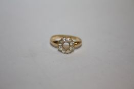 A HALLMARKED 18 CARAT GOLD AND DIAMOND RING A/F - MISSING CENTRAL STONE APPROX WEIGHT - 2.9G