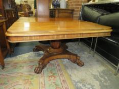 A WILLIAM IV MAHOGANY RECTANGULAR TILT-TOP TABLE RAISED ON AN OCTAGONAL BALUSTER COLUMN AND