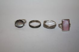 FOUR SILVER LADIES DRESS RINGS