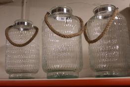 THREE MODERN DECORATIVE GLASS CANDLE HOLDERS/ JARS HEIGHT - 39CM