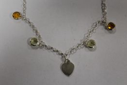 A STERLING SILVER NECKLACE WITH HEART PENDANT AND CITRINE COLOURED STONES - APPROX WEIGHT 9.4G