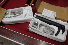 A BOX OF TAP FITTINGS