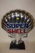 A MODERN ALUMINIUM SUPER SHELL ORNAMENT ON PLINTH - HEIGHT 50CM