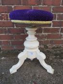 AN EDWARDIAN PAINTED CIRCULAR REVOLVING PIANO STOOL