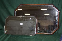 AN OAK FRAMED BEVEL EDGED OCTAGONAL WALL MIRROR, 77 CM BY 51 CM TOGETHER WITH ANOTHER 56CM X 33CM