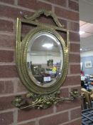 AN ORNATE BRASS WALL MIRROR WITH CANDLE SCONCES H-57 CM