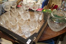 A TRAY OF CUT GLASS DRINKING GLASSES TO INCLUDE FUSHIA PATTERN EXAMPLES, VASE ETC