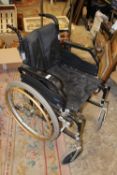A FOLD-UP WHEEL CHAIR WITH SELF PROPEL WHEELS