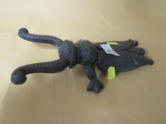 A CAST METAL BEETLE SHAPED SHOE PULL