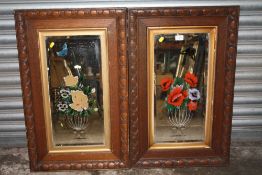 A PAIR OF VINTAGE OAK FRAMED FLORAL MIRRORS (ONE A/F) 82 CM BY 52 CM