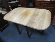 A VINTAGE OAK DROPLEAF TABLE