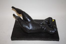 A MODERN DECORATIVE RESIN SCULPTURE OF A NUDE RECLINING FEMALE (LOOSE FROM BASE)