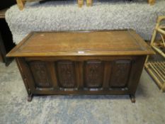 A CARVED OAK GOTHIC STYLE COFFER H-53 W-108 CM *NOTE SIDE PANEL LOOSE A/F