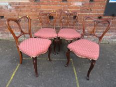 A SET OF FOUR VICTORIAN MAHOGANY DINING CHAIRS WITH PIERCED AND CARVED SPLAT