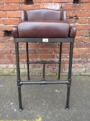 A MODERN DARK BROWN LEATHER BAR STOOL