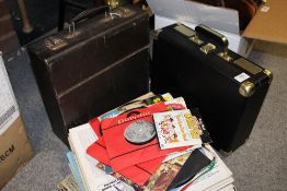 A CASED PORTABLE RECORD PLAYER BY GOODMANS TOGETHER WITH A SMALL SELECTION OF RECORDS