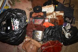A SELECTION OF HANDBAGS AND PURSES ETC