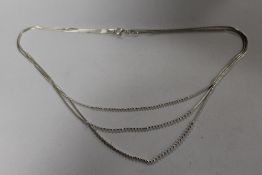 A STERLING SILVER THREE STRAND NECKLACE - APPROX WEIGHT 12.8G
