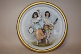 A GILT FRAMED CIRCULAR FIGURAL WALL PLAQUE