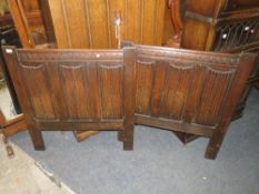A PAIR OF CARVED OAK BED ENDS W-91 CM (2)