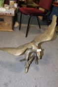 A LARGE BRASS FIGURE OF AN EAGLE ON A BRANCH HEIGHT - 53CM