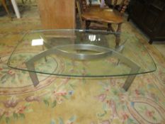 A MODERN GLASS TOPPED COFFEE TABLE WITH METAL BASE