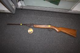 A VINTAGE .77 AIR RIFLE WITH PELLETS