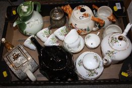 A TRAY OF NOVELTY TEA POTS TOGETHER WITH A REGENCY LILY OF THE VALLEY COFFEE SET