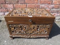 A CARVED TEAK HINGED BOX H-33 W-53 CM