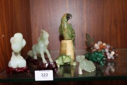 THREE MODERN CARVED JADE STYLE ANIMAL FIGURES, TOGETHER WITH A MALACHITE FIGURE OF A LION,