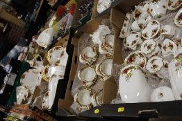 FOUR TRAYS OF ROYAL ALBERT OLD COUNTRY ROSES CHINA TO INCLUDE TEA AND COFFEE POTS, CUPS AND SAUCERS,
