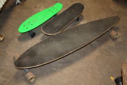 A LONGBOARD, PENNYBOARD AND A CHILD SIZE SKATEBOARD