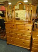 A DUCAL HONEY PINE FOUR DRAWER CHEST AND A MIRROR W-86 CM