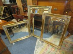 A MODERN SET OF THREE GILT WALL MIRRORS - LARGEST 108 X 76 CM (3)