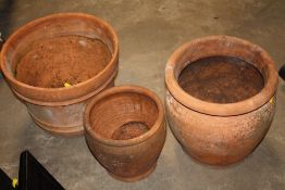THREE TERRACOTTA PLANT POTS