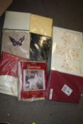 A QUANTITY OF PACKAGED BED SHEETS ETC.