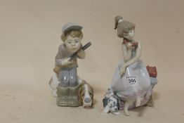 A LLADRO FIGURE OF A SEATED GIRL ON THE TELEPHONE WITH A DALMATIAN, TOGETHER WITH A LLADRO HUNTER