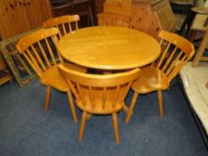 A MODERN CIRCULAR KITCHEN TABLE AND 4 CHAIRS