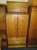 A HONEY PINE COMBINATION WARDROBE ** DRAWER MISSING** TOGETHER WITH A PINE BLANKET BOX (2)