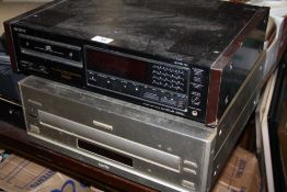 A SONY 557ESD COMPACT DISC PLAYER, TOGETHER WITH A PIONEER CLD-959 LASER DISC PLAYER