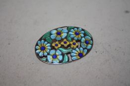 A HALLMARKED SILVER FLORAL ENAMEL BROOCH