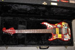 A WASHBURN NUNO BETTENCOURT MODEL LEFT HANDED ELECTRIC GUITAR WITH 2 HARD CASES