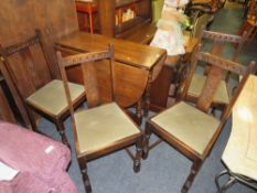AN OAK DROPLEAF TABLE AND FOUR CHAIRS
