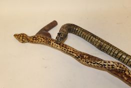 TWO HAND CARVED WALKING STICKS