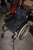 A FOLD-UP WHEEL CHAIR WITH SELF PROPEL WHEELS