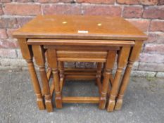 A SOLID OAK NEST OF TABLES W-51 CM LARGEST