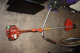 A HUSQVARNA PETROL STRIMMER